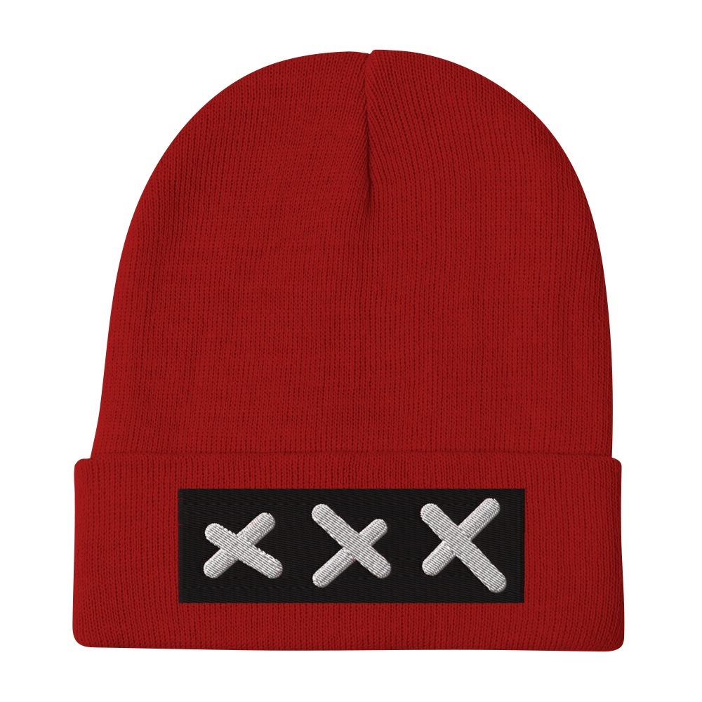 Introducing the Bold & brave XXX (3 Amsterdam Crosses) embroidered Beanie, a striking red knit beanie featuring a black front patch adorned with three white Amsterdam Crosses embroidered in a row.