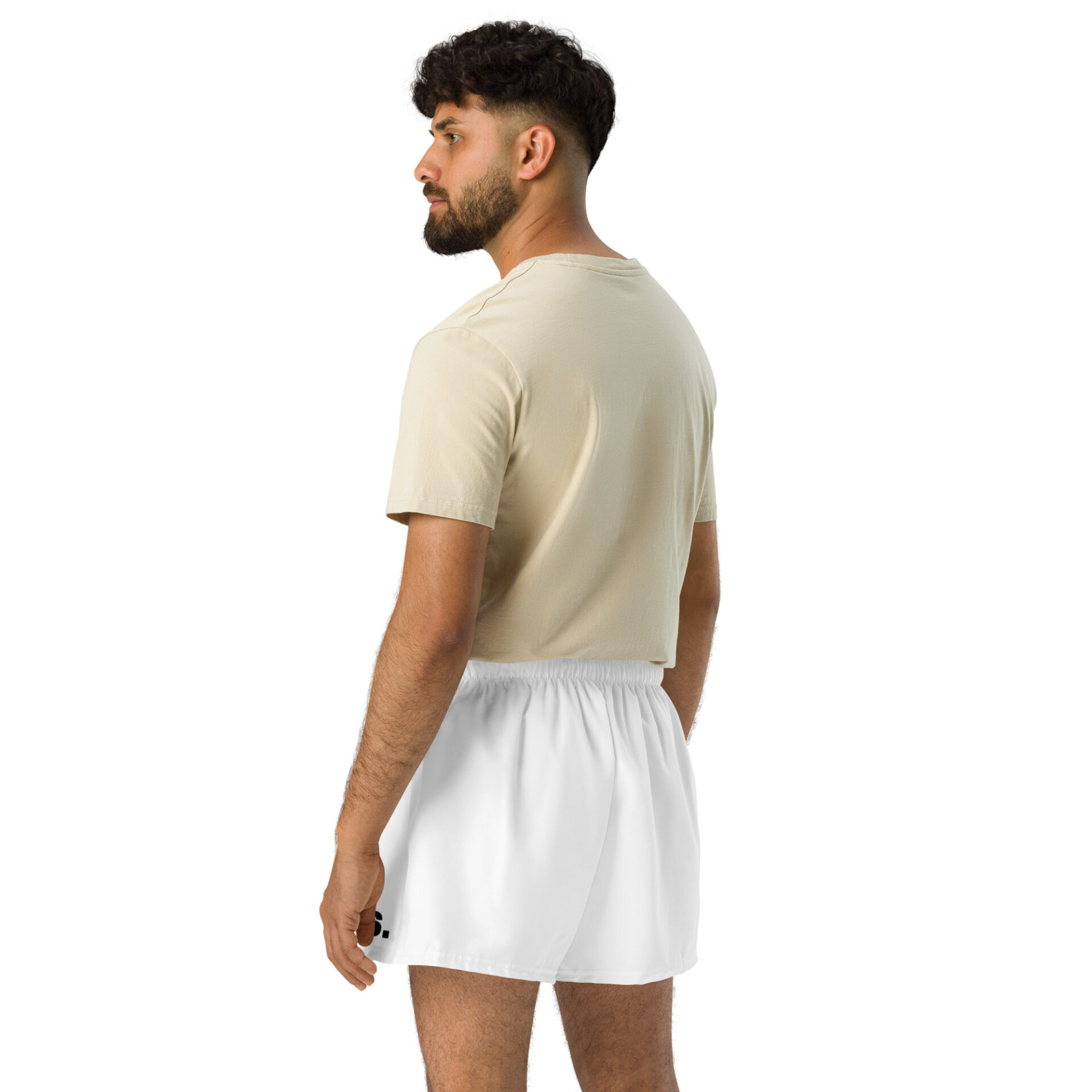 A man with short dark hair and a beard stands facing away, looking left. He sports a light beige t-shirt with BAAS Athletic Shorts in crisp white, capturing a casual sportswear vibe against the plain white background. A man with short dark hair and a beard stands facing away, looking left. He sports a light beige t-shirt with BAAS Athletic Shorts in crisp white, capturing a casual sportswear vibe against the plain white background.